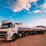 white water truck parked on industrial field